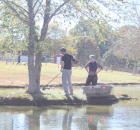 johnathan-cody-rowing-out-to-weed-eat-the-island1